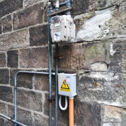 Sign "Danger Electricity" in Rocks area