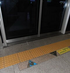 More signs on the platform floor.