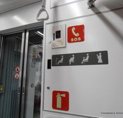 More signs inside a subway car.