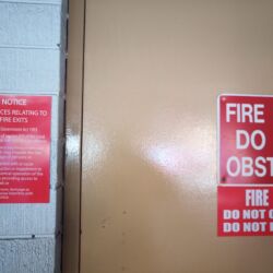 It is an offense to block a fire exit. Way more informative than the ones in US